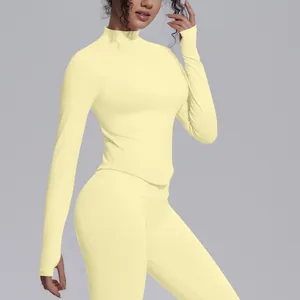 Detailed side view of a women's yellow knitted zip-up yoga jacket with high collar design
