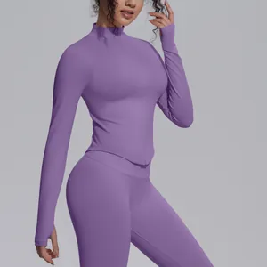 Detail view of purple stand collar knitted yoga jacket with thumbholes and zipper.