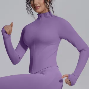 Close-up of slim fit purple yoga jacket with stand collar and thumbholes