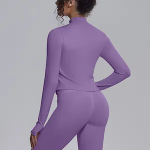 Detailed back view of purple long sleeve zip-up yoga jacket with mock neck and thumbholes