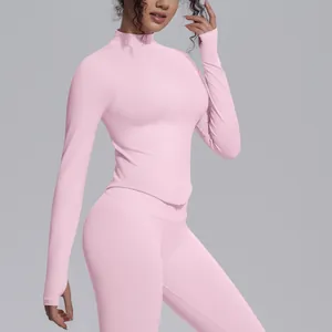 Detailed view of women's pink knitted yoga jacket with stand collar and slim fit