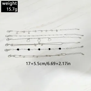 Close-up detail of a 6pcs set fashion silver star and heart charm bracelets for women