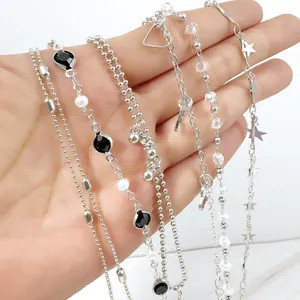 Detailed view of fashion 6-piece silver bracelet set with stars and black beads