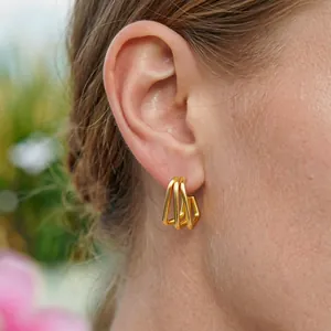 Minimalist gold-plated stainless steel geometric earrings with a multi-layered line design.