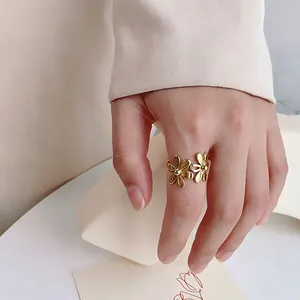 Elegant golden double flower open ring made of durable titanium steel for women fashion