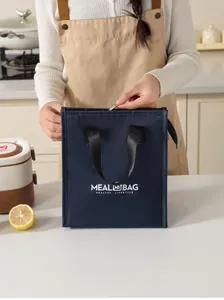 Close-up view of a navy blue insulated lunch bag featuring a stylish logo print