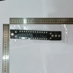 Detail measurement view of a punk black braided leather bracelet with silver studs.