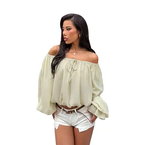 Elegant cream off-shoulder blouse featuring lantern sleeves and a drawstring tie front.