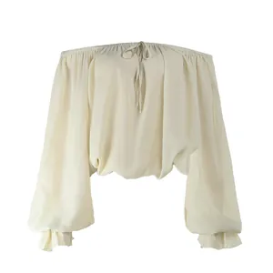 Elegant off-the-shoulder lantern sleeve blouse with adjustable tie neckline in cream white
