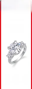Macro view of 925 silver moissanite ring with three large round-cut center stones
