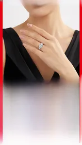 Close-up of 5-carat moissanite ring on model's hand with 925 silver band
