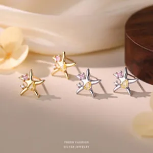 Detailed view of S999 silver star stud earrings with colorful sparkling cubic zirconia