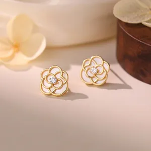 Detailed view of S999 sterling silver flower earrings with white petals and zircon