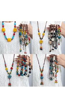 Detailed view showing various handmade ceramic necklaces in Bohemian ethnic style.