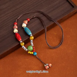 Macro detail of ethnic ceramic beaded necklace with weight 48g/1.69oz specification