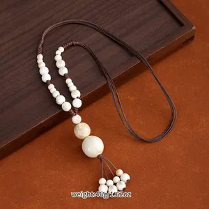 Jingdezhen ceramic bead necklace with ethnic style woven rope and long sweater chain