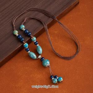 Detailed view of Jingdezhen ceramic bead necklace with ethnic braided cord and weight info