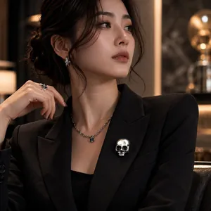 Elegant Asian model wearing retro silver skull brooch and necklace set for Halloween.