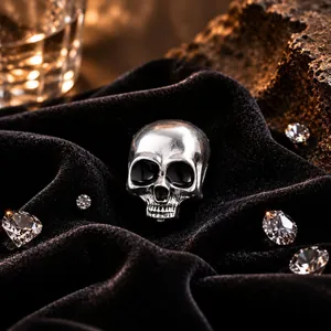 Premium vintage silver skull brooch displayed on black velvet for Halloween theme