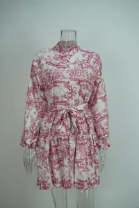 Elegant white mini dress featuring red toile de jouy print and adjustable waist tie belt