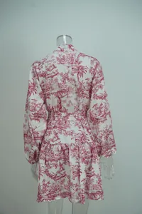 Back view of elegant red floral print mini dress with pleated hem and long sleeves