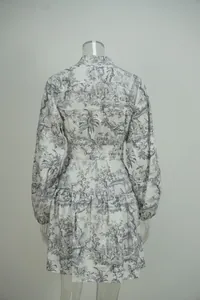 Rear view of an elegant long-sleeve mini dress featuring grey landscape toile print