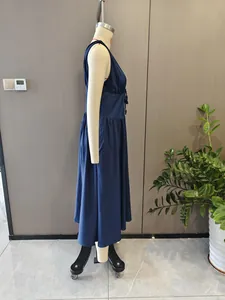 Side view of elegant navy blue backless high-waist maxi dress on mannequin