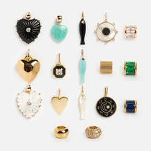 Detailed view of an assortment of colorful jewelry pendants and charms in various shapes
