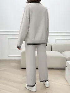 Detailed back view of casual oatmeal knit two-piece sweater and wide-leg pants outfit.