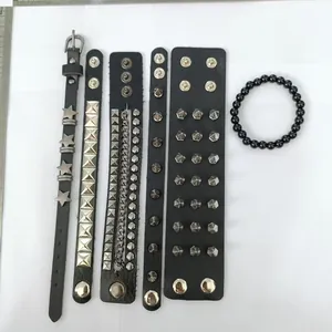 Detailed view of 6 punk leather bracelets with metal studs and stars