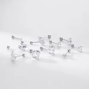 Close-up detail of multiple S925 sterling silver stud earrings with clear zirconia stones