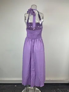 Detailed back view of a purple halter neck maxi dress with smocked waist detail.