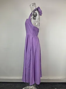 Side view of purple halter neck backless dress with smocked detailing