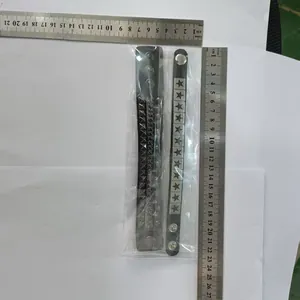 Detailed view of two punk style leather bracelets with rulers showing exact size measurements.