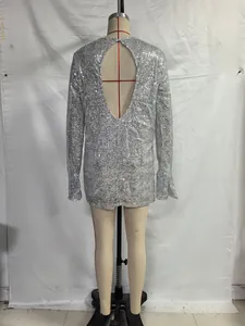 Detailed back view of a shimmering silver sequin long sleeve mini dress on a mannequin