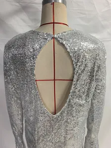 Back view detail of a silver sequined bodycon dress with an elegant teardrop cutout