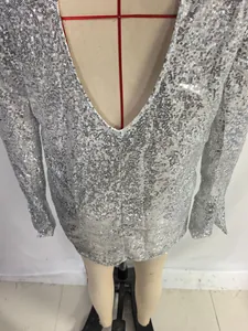 Detail view of a stunning silver sequin long sleeve bodycon mini dress for women