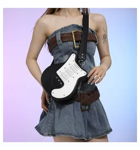 Detail view of a stylish black and white guitar-shaped crossbody chest bag on a model.