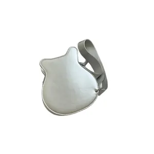 Unique silver guitar-shaped crossbody bag with wide strap for street style fashion