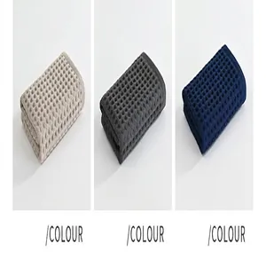 Detail view of waffle weave cotton towels in three colors: coffee, grey, and blue