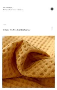 Close-up of premium yellow cotton waffle weave towel fabric texture and soft detail