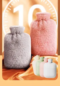Detail view of plush hot water bottles with soft removable covers in grey and pink