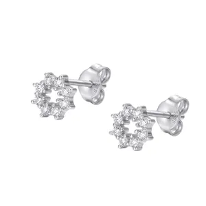 Detailed macro view of S925 sterling silver snowflake stud earrings with sparkling zirconia