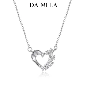 Detailed view of silver heart pendant with shimmering cubic zirconia stone settings