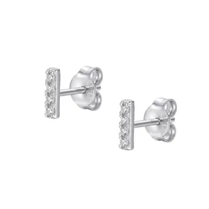 Macro view of minimalist S925 silver bar stud earrings with sparkling cubic zirconia.