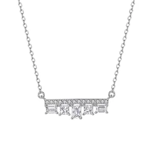 Detailed macro view of S925 sterling silver necklace with five sparkling cubic zirconia stones.