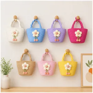 Detailed view of colorful handmade woven cotton rope mini tote bags in seven colors