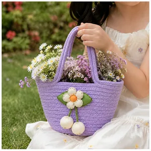 Purple hand-woven cotton rope bucket bag with daisy flower decoration for girls.
