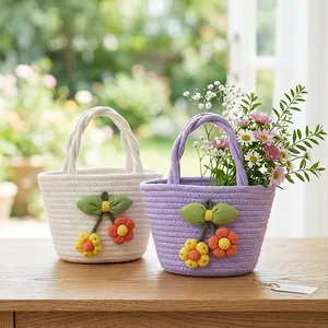 Handwoven cotton rope mini tote bag with cute floral appliques for gifts.
