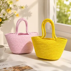 Two beautiful hand-woven cotton rope basket tote bags in vibrant pink and yellow